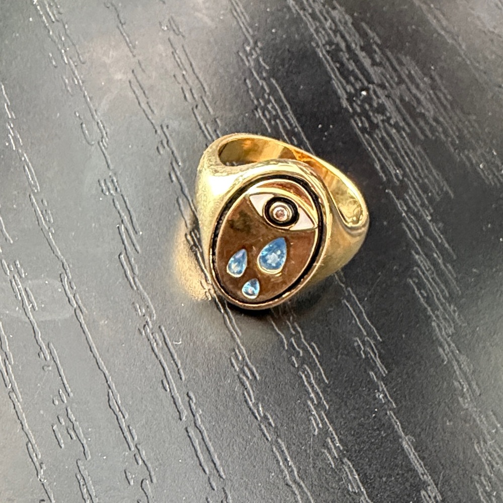 Gold Eye Motif Ring with Blue Accent Stones